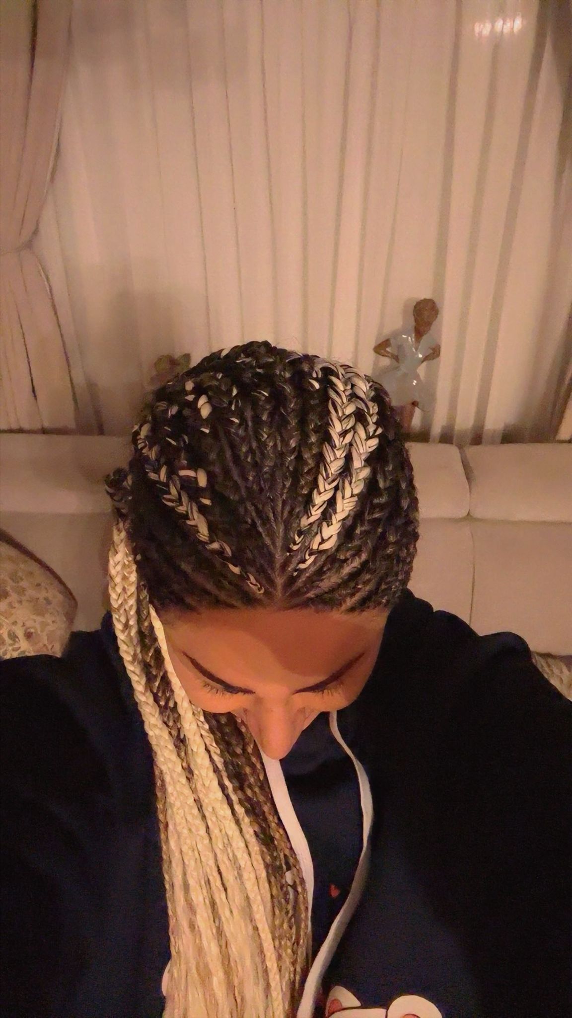Blonde and black cornrow braids